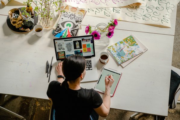 person working on images for marketing on a table t